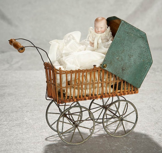 4" German all-bisque Bye-lo Baby in woven miniature carriage. $300/500