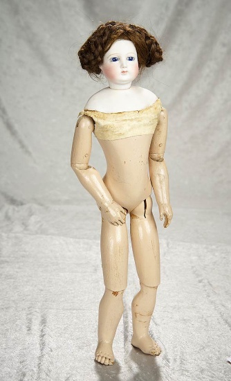 18" French bisque poupee with cobalt blue eyes and rare wooden articulated body. $2400/2800