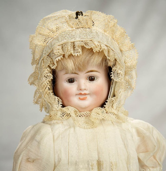 12" German bisque three-faced doll by Carl Bergner, original body and antique costume. $800/1200