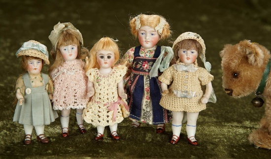 Five 4"-6" German all-bisque miniature dolls in antique costumes. $400/600