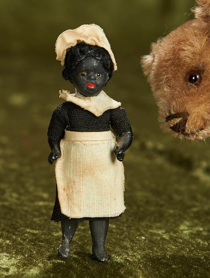 3 1/2" German all-bisque black-complexioned doll as parlor maid. $300/400