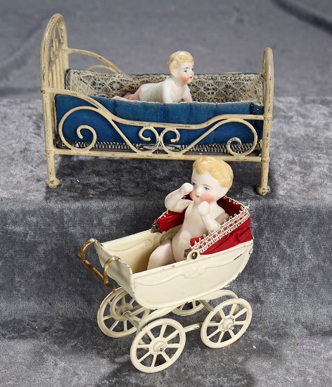 6"l. bed. Metal baby bed and tin carriage with two bisque dolls. $400/500