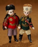 Two French All-Bisque Miniature Dolls in Original Military Parade Costumes 500/800