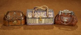 Three French Leather and Silk Cases for Bebes or Poupees 500/700