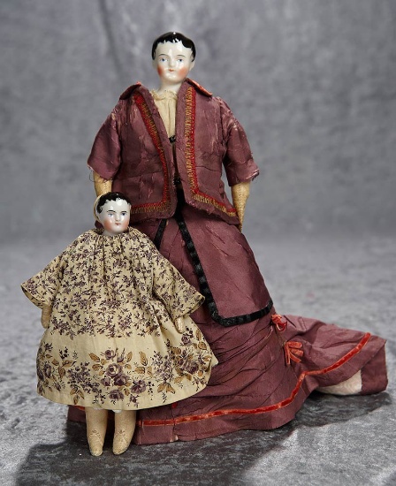 Two 7" and 11" 19th Century Dolls for the French market in original costumes. $400/600