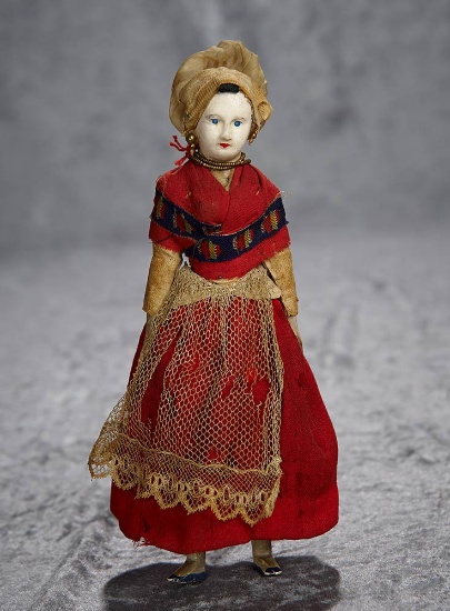 8" Early French paper mache doll in original costume. $300/500