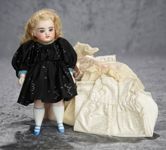 9" German all-bisque doll with lovely face, and with original trousseau. $500/700