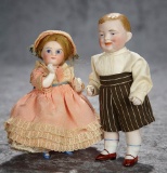 Two German all-bisque dolls including rare girl with blue heeled shoes. $300/400