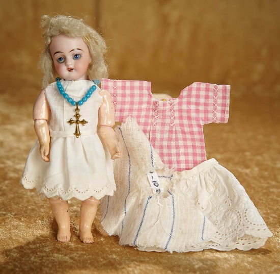 6 1/2" German bisque miniature doll with fully-articulated body. $300/400