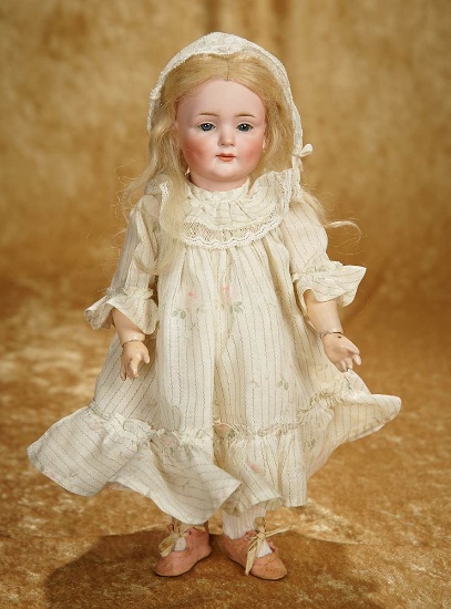 12" German bisque smiling character, glass eyes and closed mouth, 549,  Kley and Hahn. $1400/1800