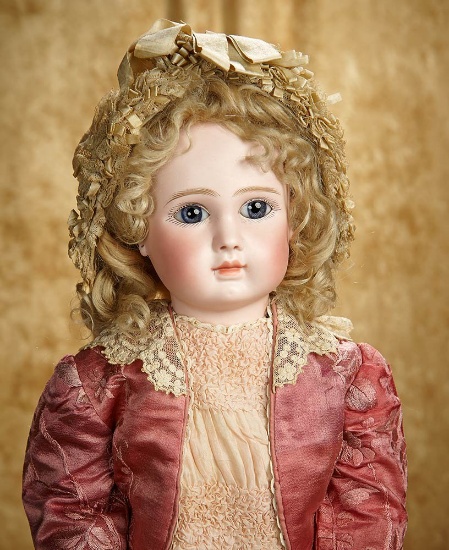 23" French bisque bebe by Jules Steiner, Figure A, original signed body, lovely costume. $2800/3400