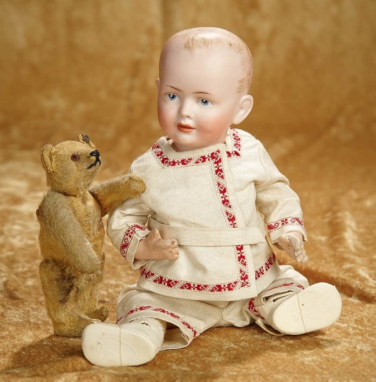 10" German bisque character, 131, by Hertel and Schwab with early tiny Teddy by Steiff. $600/800