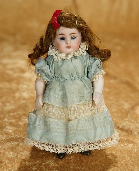 7" German all-bisque doll with original wig, silk dress, by Kestner. $400/500