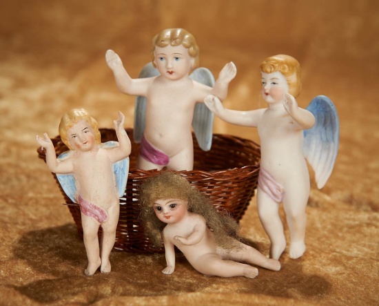 3 1/2"-4" Three German all-bisque angels and a little bisque seated doll. $200/400