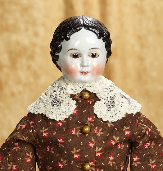 20" German porcelain doll with rare brown glass eyes. $400/500