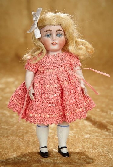 8 1/2" German all-bisque doll by Kestner with sleep eyes and original wig. $400/500