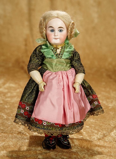 10" Petite Sonneberg bisque closed mouth doll with original costume by mystery maker. $700/900