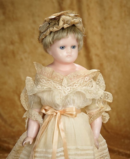 17" German wax over paper mache doll with lovely original costume. $500/700