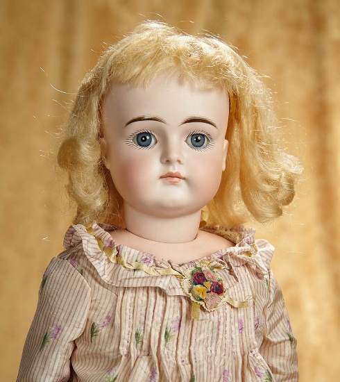 20" German bisque closed mouth doll by Kestner with beautiful dress. $500/700