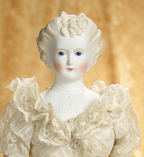 22" German bisque lady with sculpted blonde hair and fancy bodice. $500/700