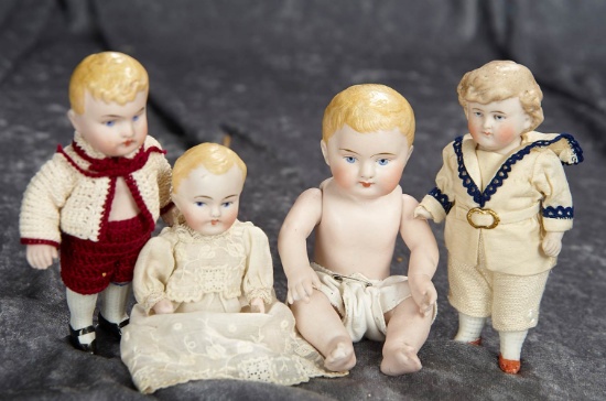 Four 5"-7" German all-bisque dolls with sculpted blonde hair. $400/600