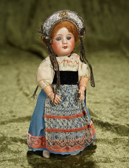 7" French bisque petite bebe by SFBJ with original folklore costume. $200/300