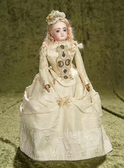 15" French bisque poupee by Jumeau in lovely ivory silk costume. $1400/1700