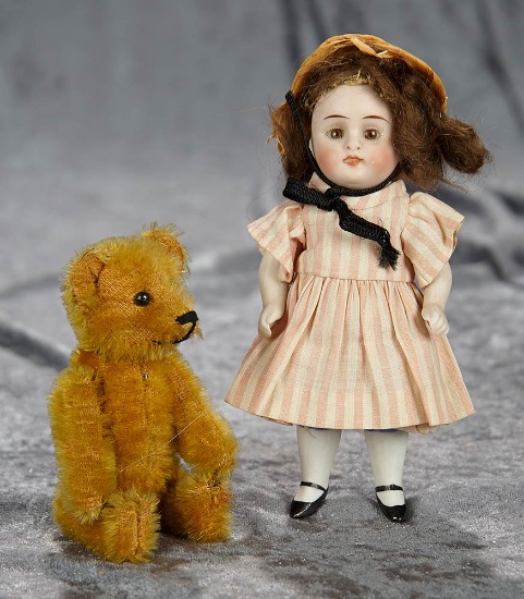 6" German all-bisque doll along with 5" mohair teddy perfume bottle. $300/500