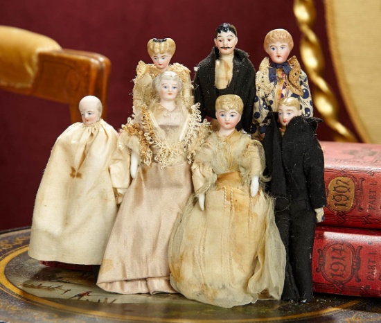 German Bisque Family of Seven Dollhouse Dolls in Original Costumes, with Provenance 1000/1300