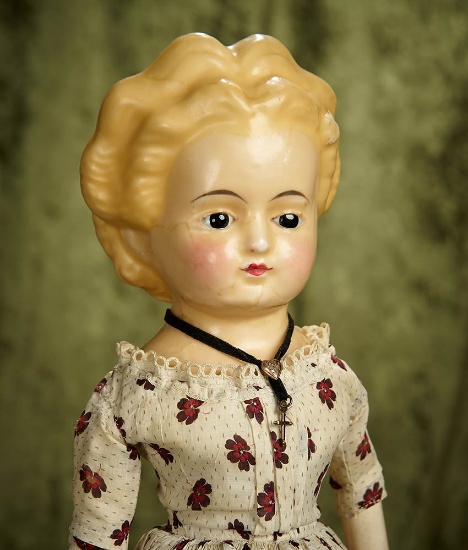 22" German wax over paper mache glass-eyed doll with original body. $300/400