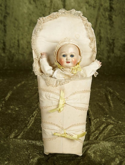 16" overall. Unusual early paper mache bunting baby in original presentation. $400/500