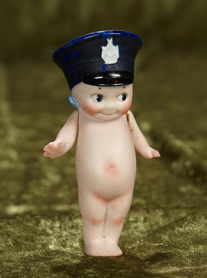 4" German all-bisque Policeman Kewpie with sculpted police cap. $400/500