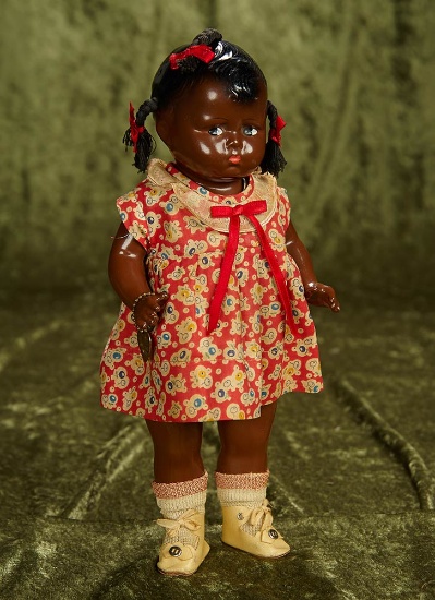 13" American composition "Baby Grumpy" by Effanbee, rare brown complexion. $300/400