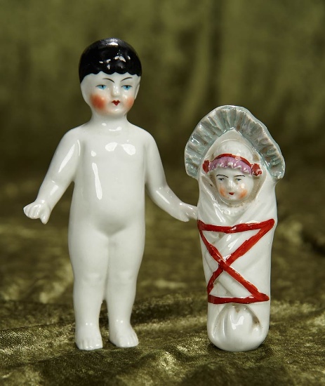 4 1/2" - 5 1/2" Two German porcelain novelty dolls. $300/400
