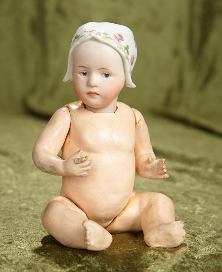 8" German bisque Baby Stuart with sculpted bonnet. $300/400