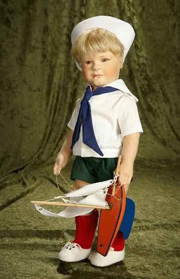 18" American felt artist doll "Arthur" by R. John Wright with toy boat, #74/500. $400/600