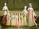 Set of five miniature porcelain half dolls in original box, with four others. $300/400
