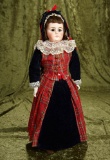 Sonneberg bisque doll with closed mouth and pouting expression. $400/600
