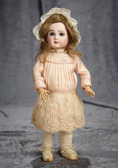 12" French bisque bebe, Figure A, by Jules Steiner in dainty size. $1600/1900