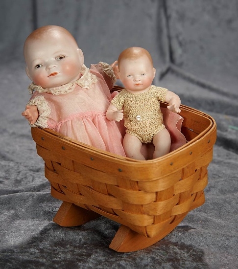6" & 9", Two Petite Bye-Lo babies, including all-bisque, in a basket cradle. $300/400