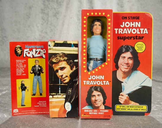 Fonzie and John Travolta celebrity dolls, mint in original boxes. $100/200