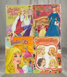 Three paper doll books for Barbie and family. $200/300