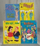 Four uncut paper doll books. $150/250