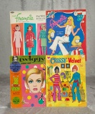 Four Barbie family paper doll books, 1970s. $100/200