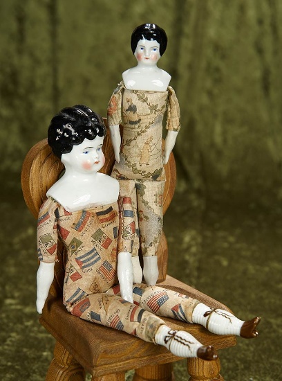 8"-10" Two German porcelain dolls with rare printed cloth bodies. $200/300