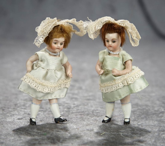 Pair, 4" German all-bisque miniature dolls with glass eyes. $200/400