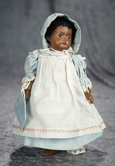 8" German brown bisque complexioned miniature doll with antique costume. $300/500
