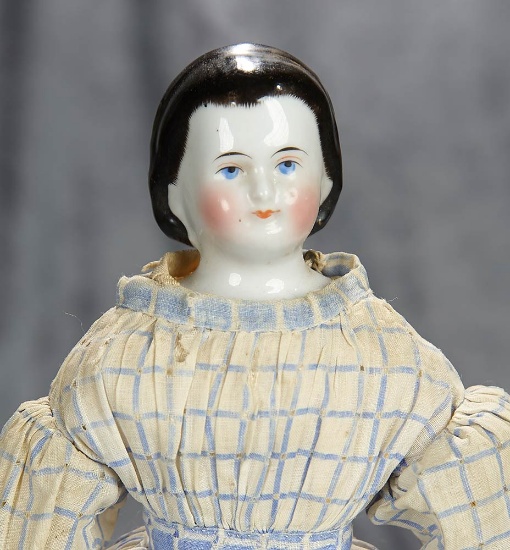 13" German porcelain lady with sculpted snood and antique costume. $400/500