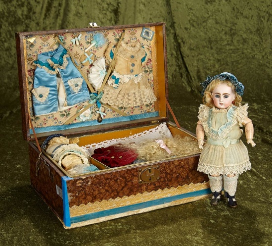 10 1/2" French bisque bebe with trunk laden with dresses, bonnets, accessories. $1900/2300