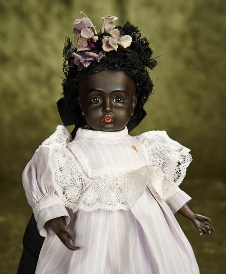 12" French black-complexioned bebe, Leon Casimir Bru, costume, signed Bru shoes. $7500/10,500